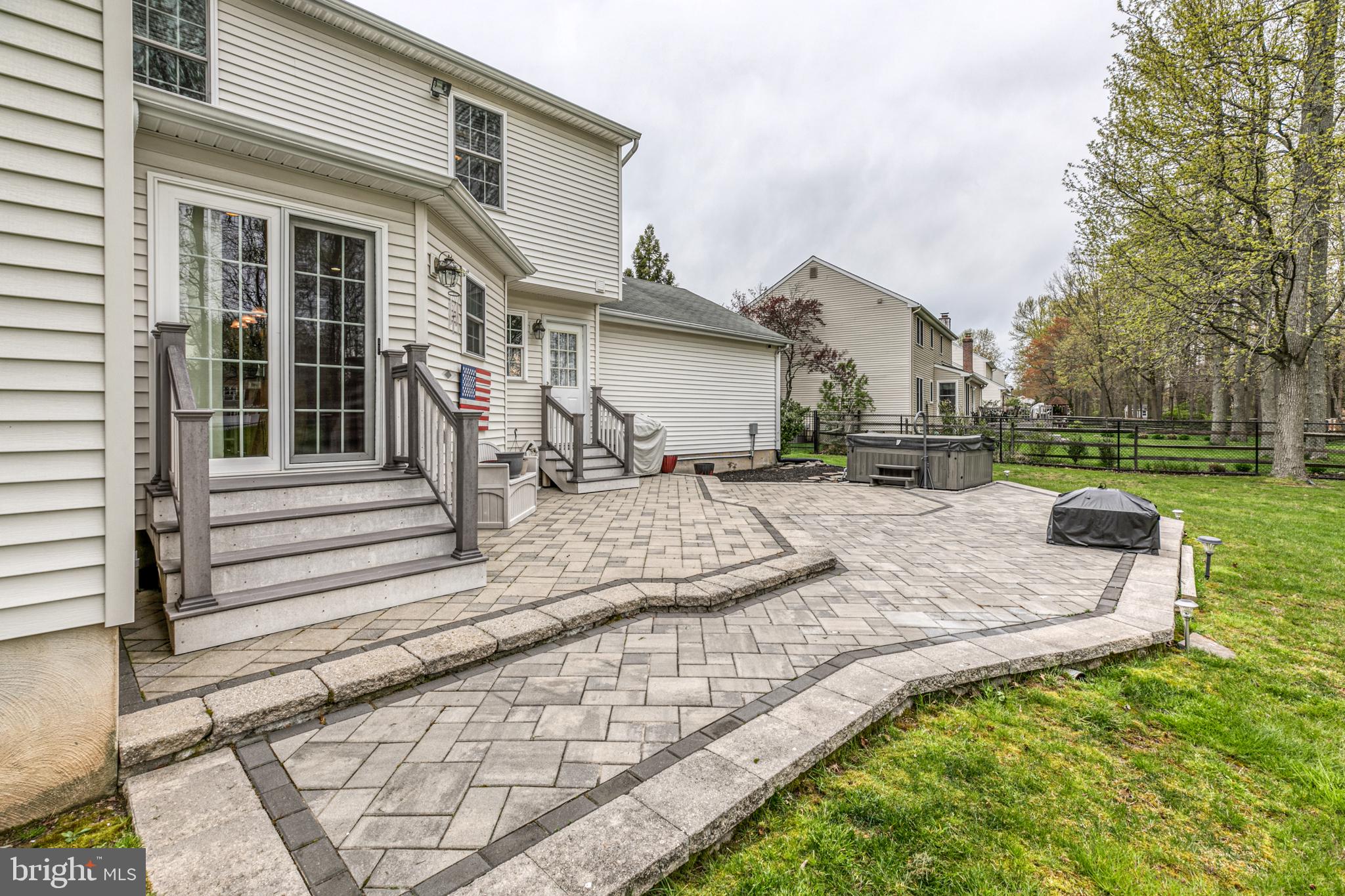 148 Flint Road Langhorne, PA 19047 - Photo 34 of 39 Custom tiered paver patio with hot tub