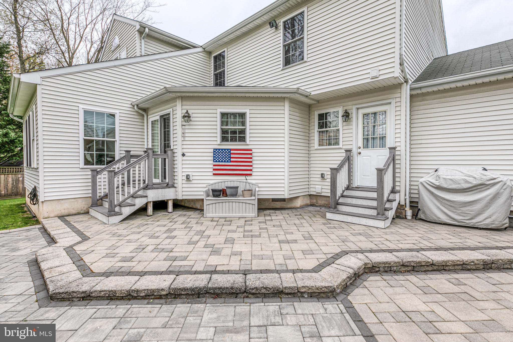 148 Flint Road Langhorne, PA 19047 - Photo 35 of 39 Custom tiered paver patio with hot tub