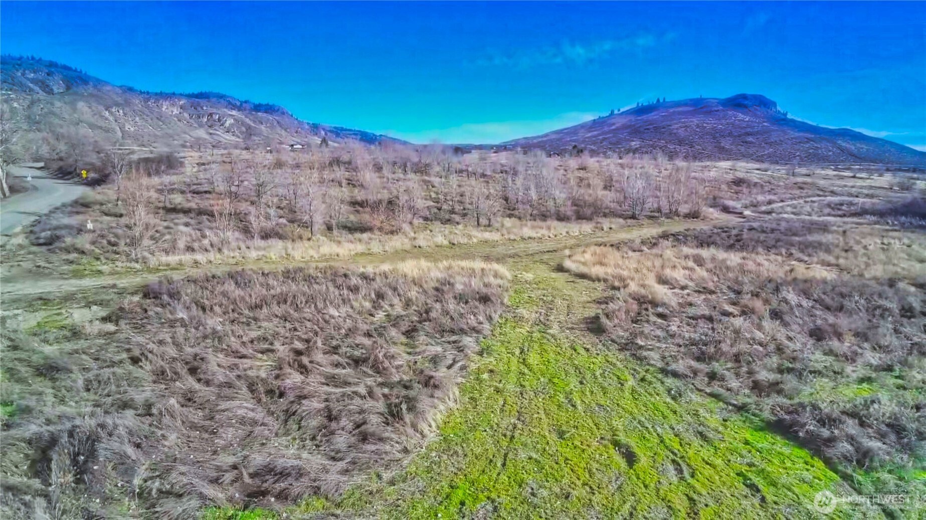407-tbd Eastlake Road Oroville, WA 98844 - Photo 6 of 12 a view of a backyard with wooden fence