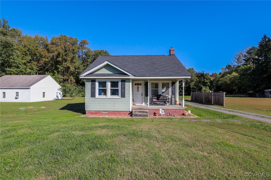 10432 Verdon Road Doswell, VA 23047 - Photo 2 of 30 a front view of a house with table and chairs