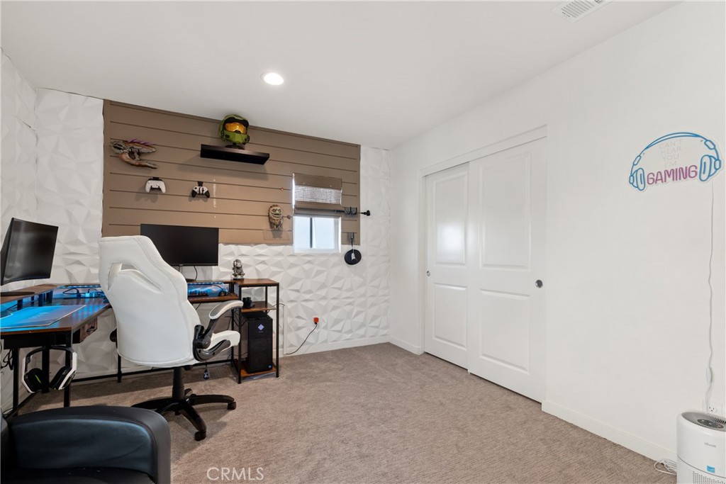 28341 Heather Grn Way Menifee, CA 92584 - Photo 19 of 44 Upstairs bedroom currently used as gaming room