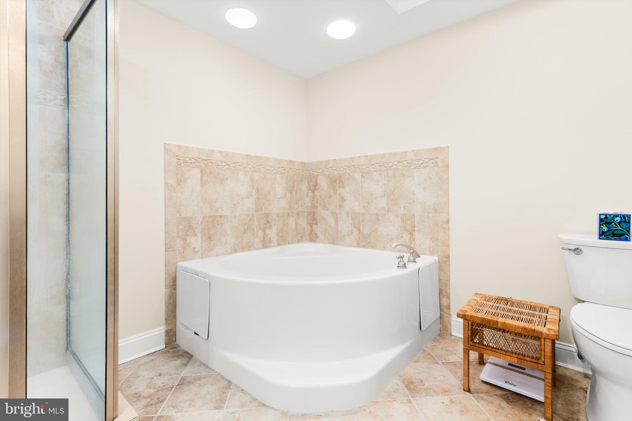 530 Riverside Drive, Unit 202 Salisbury, MD 21801 - Photo 20 of 38 a white bath tub sitting next to a white toilet