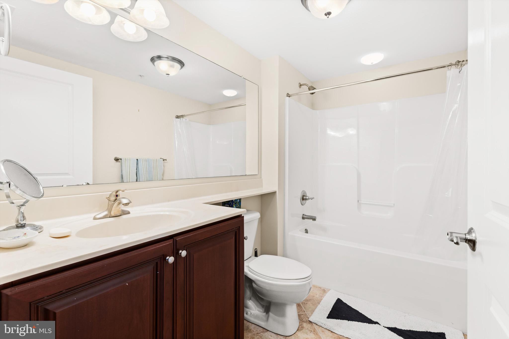530 Riverside Drive, Unit 202 Salisbury, MD 21801 - Photo 24 of 38 a bathroom with a sink a toilet and shower