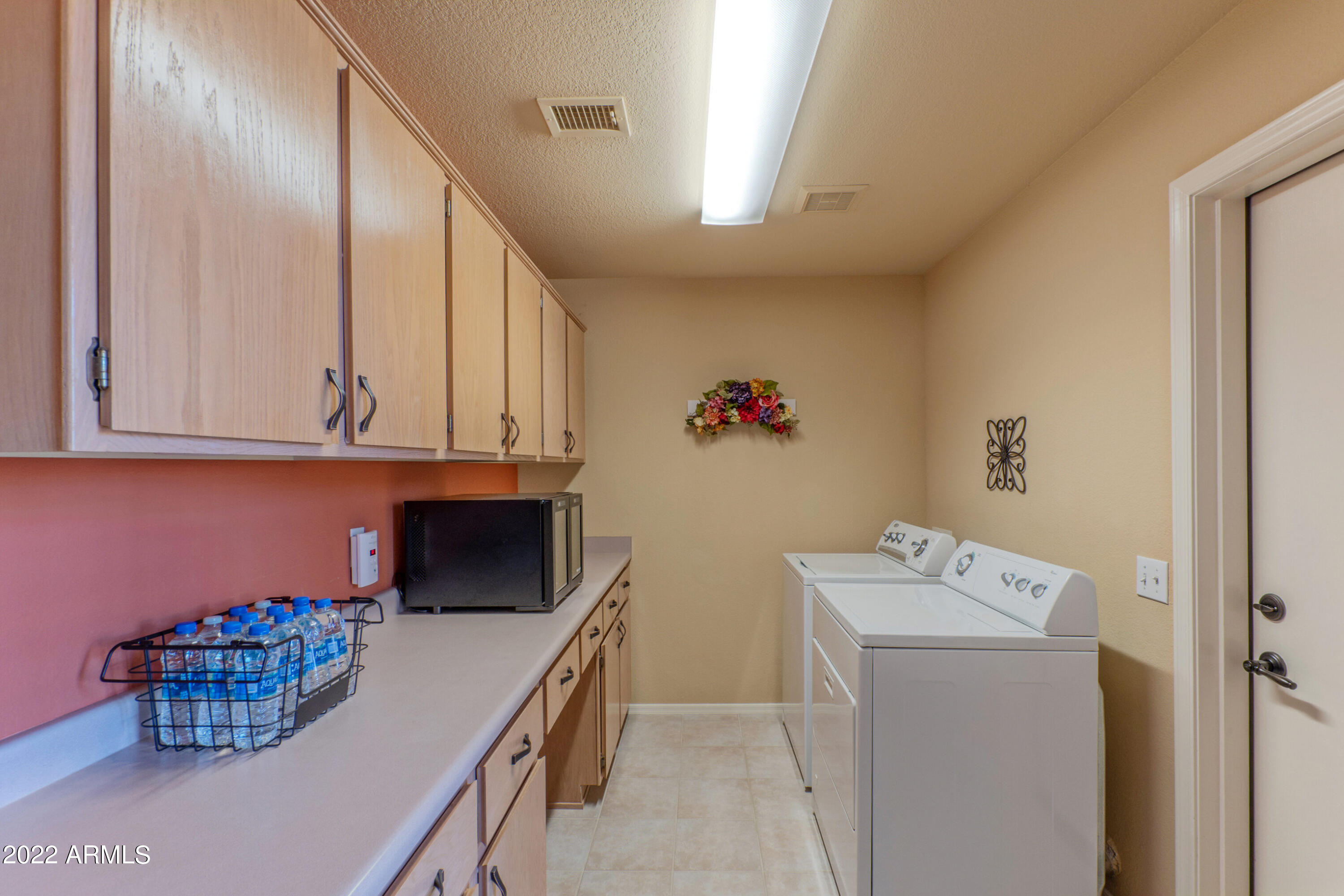 15511 Piccadilly Road Goodyear, AZ 85395 - Photo 25 of 31 Laundry room with extra storage