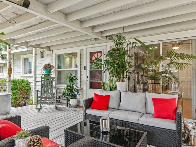 a dining room with furniture and a chandelier