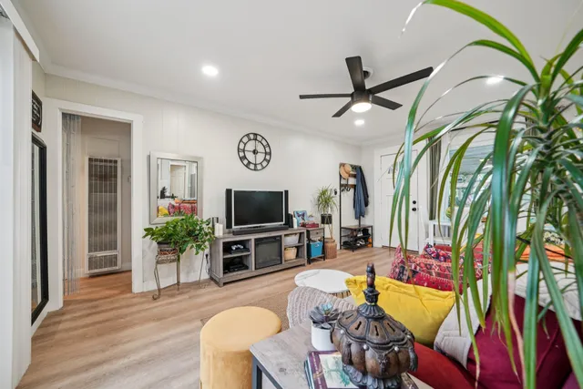 a bathroom with a sink toilet vanity and window