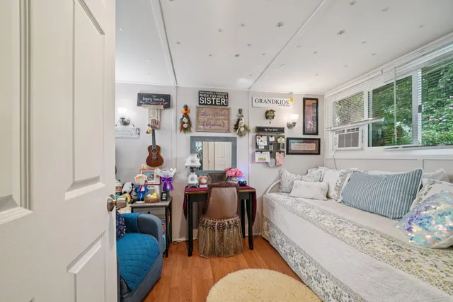 a view of a patio with table and chairs under an umbrella