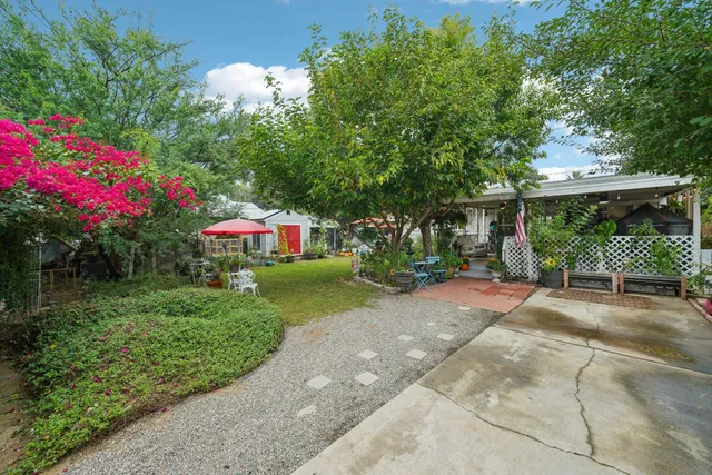 a kitchen with stainless steel appliances kitchen island granite countertop a stove a sink and a microwave