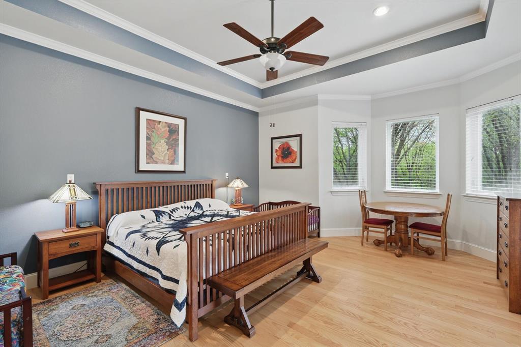 8517 Stallion Street Denton, TX 76208 - Photo 15 of 36 a bed room with a bed and a table