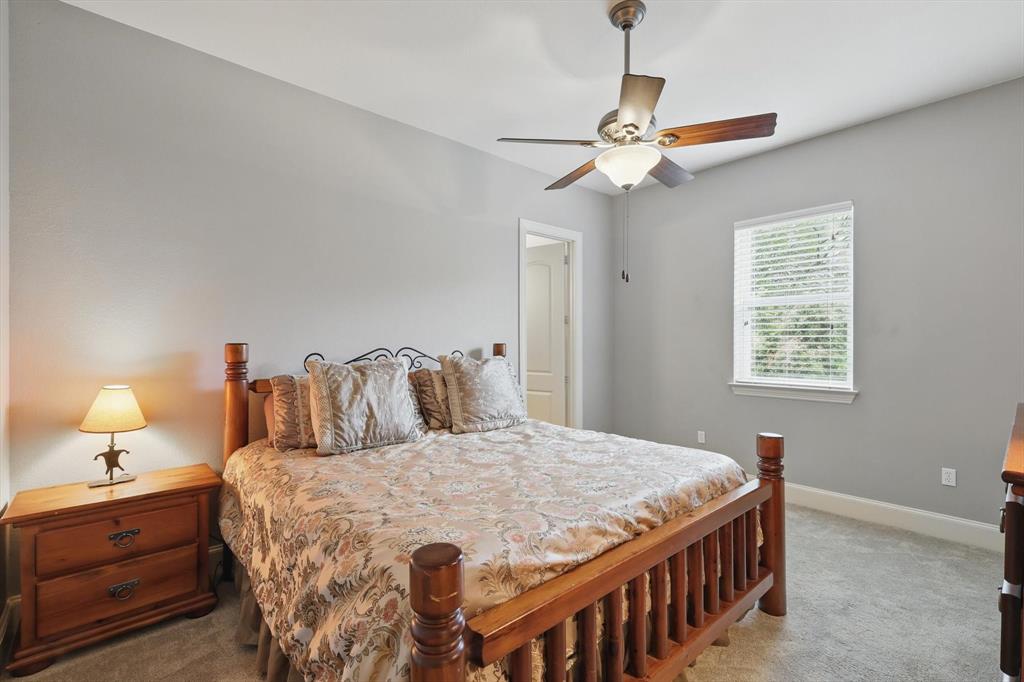 8517 Stallion Street Denton, TX 76208 - Photo 19 of 36 a bedroom with a bed and window