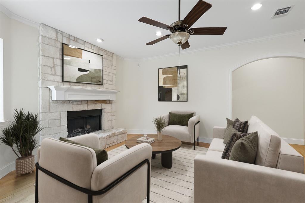 8517 Stallion Street Denton, TX 76208 - Photo 28 of 36 a living room with furniture and a fireplace