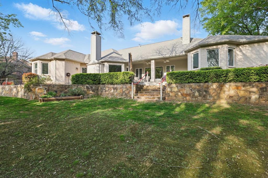 8517 Stallion Street Denton, TX 76208 - Photo 34 of 36 a front view of a house with a yard