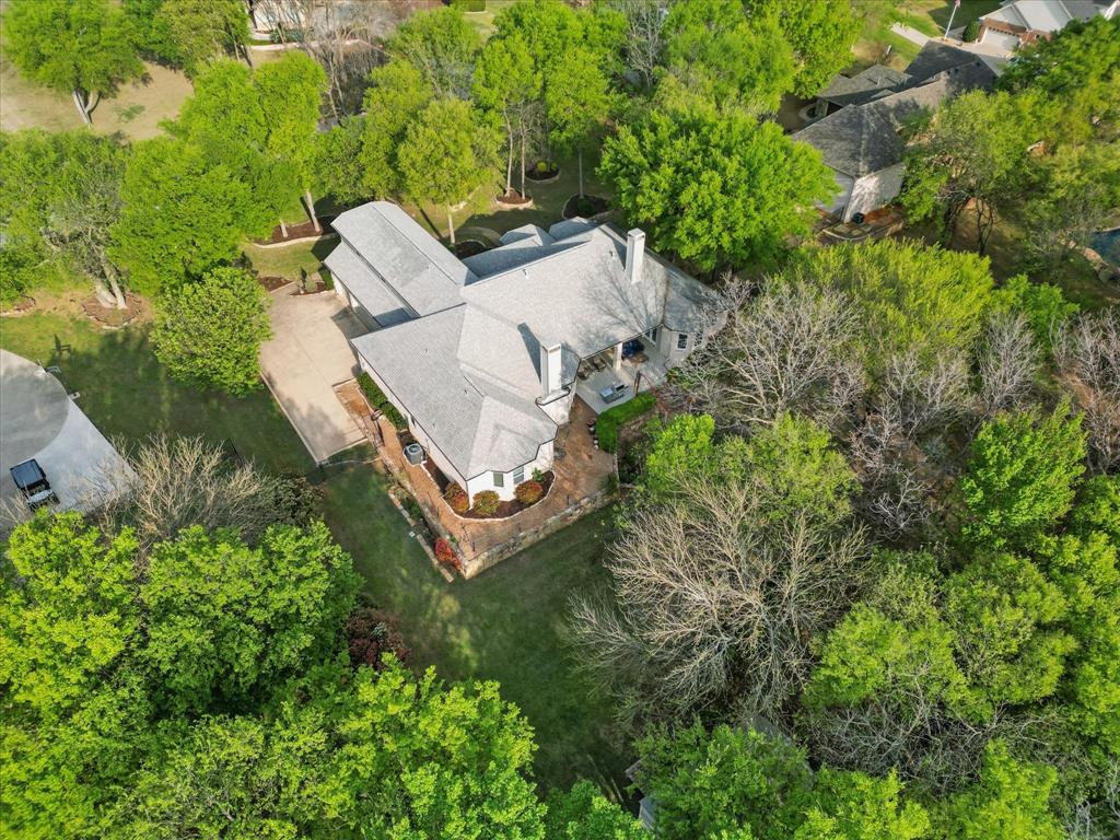 8517 Stallion Street Denton, TX 76208 - Photo 36 of 36 an aerial view of a house with a yard and lake view