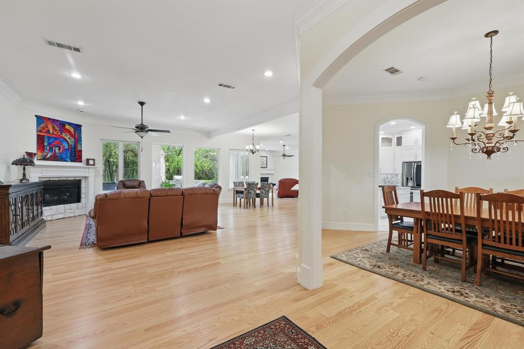 8517 Stallion Street Denton, TX 76208 - Photo 4 of 36 a living room with furniture and a chandelier