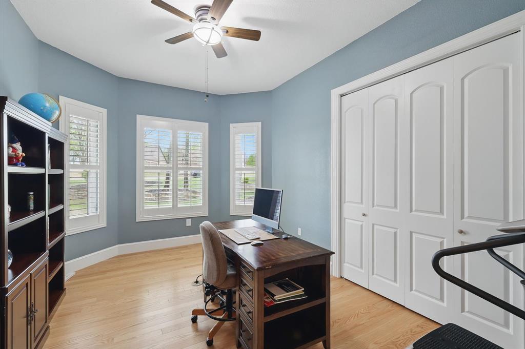 8517 Stallion Street Denton, TX 76208 - Photo 5 of 36 a view of a workspace with furniture and a window