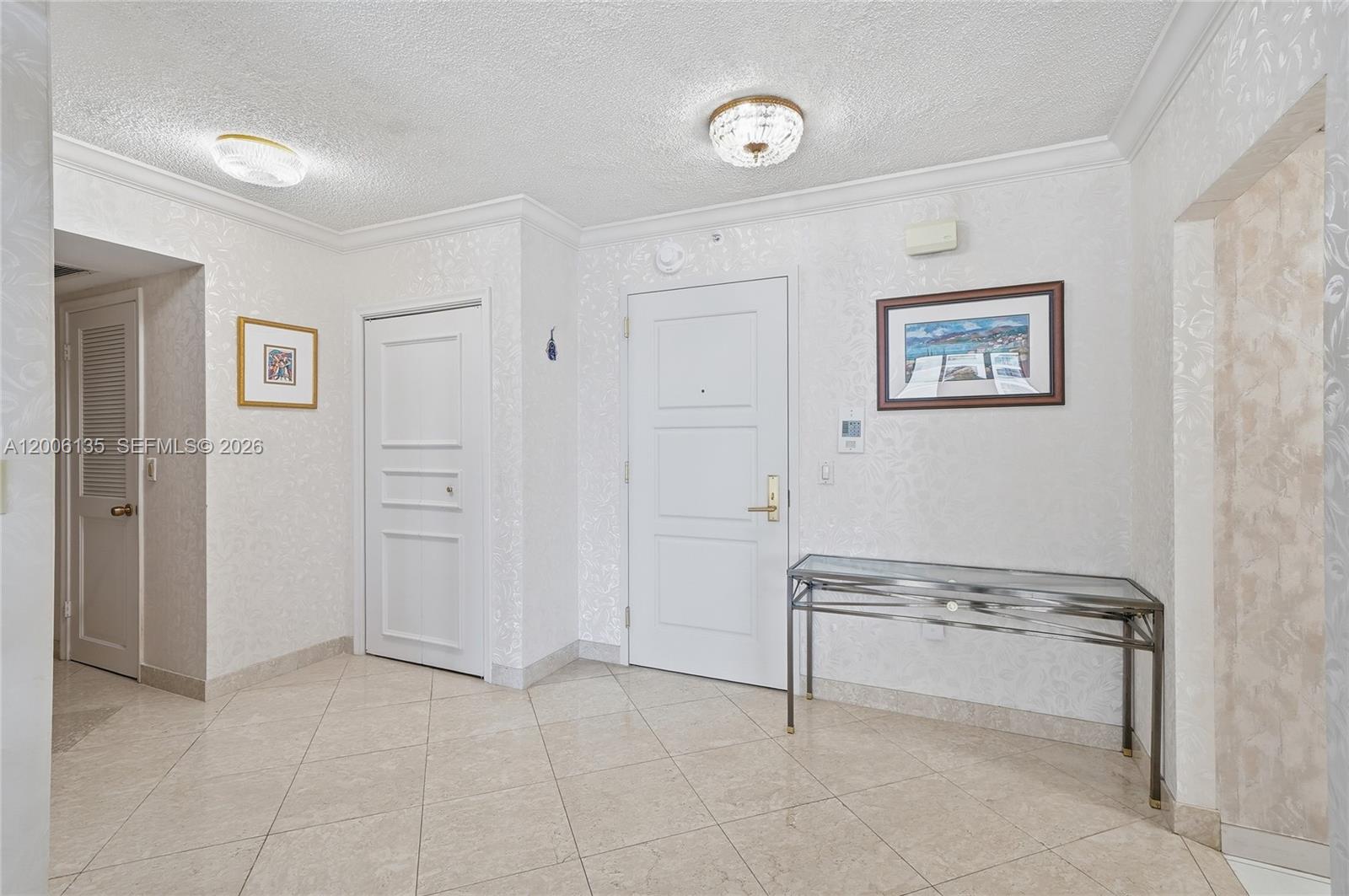 9801 Collins Avenue, Unit 14D Bal Harbour, FL 33154 - Photo 14 of 52 an empty room with windows and closet