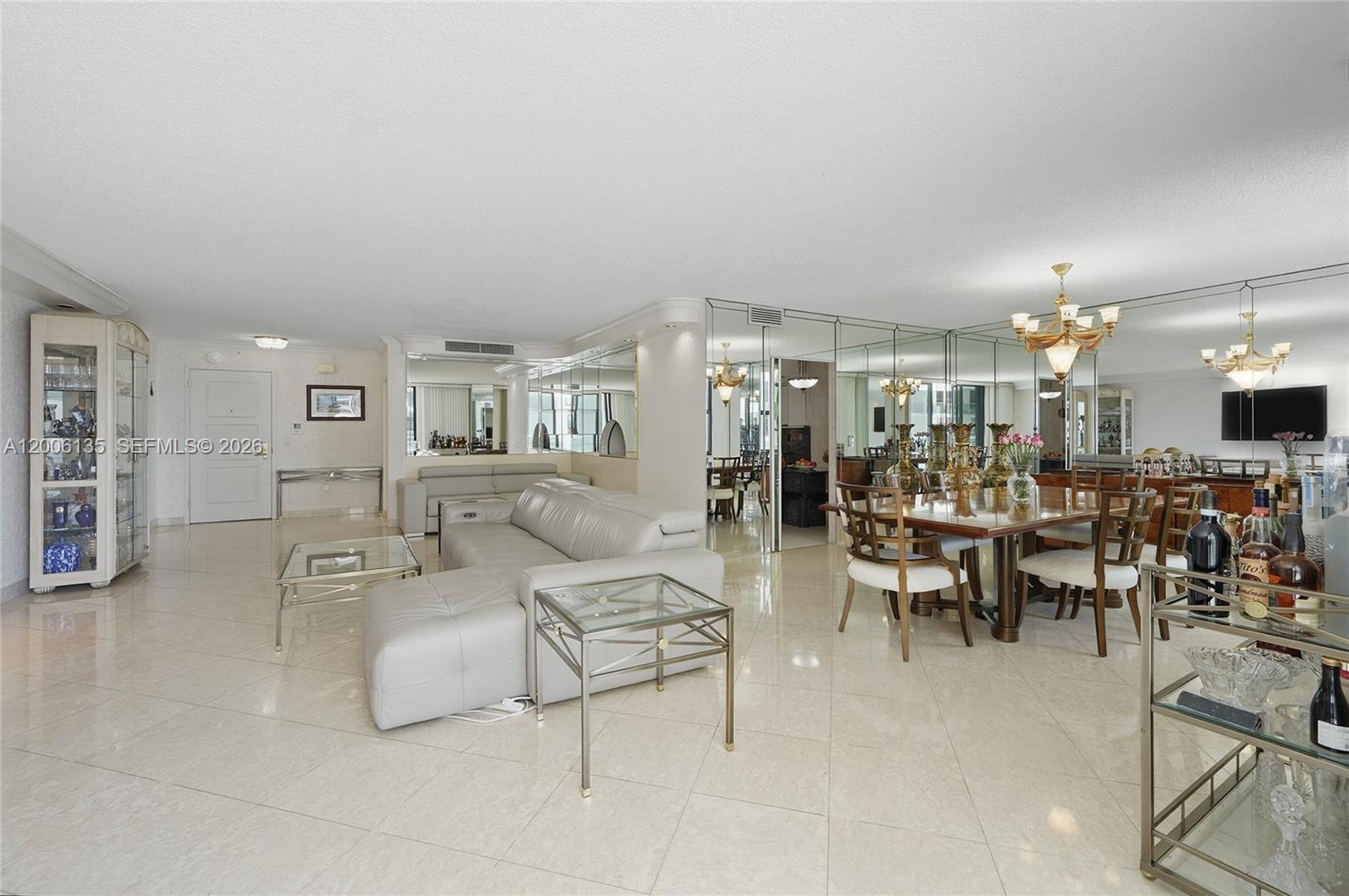 9801 Collins Avenue, Unit 14D Bal Harbour, FL 33154 - Photo 25 of 52 a living room with lots of furniture and lots of furniture