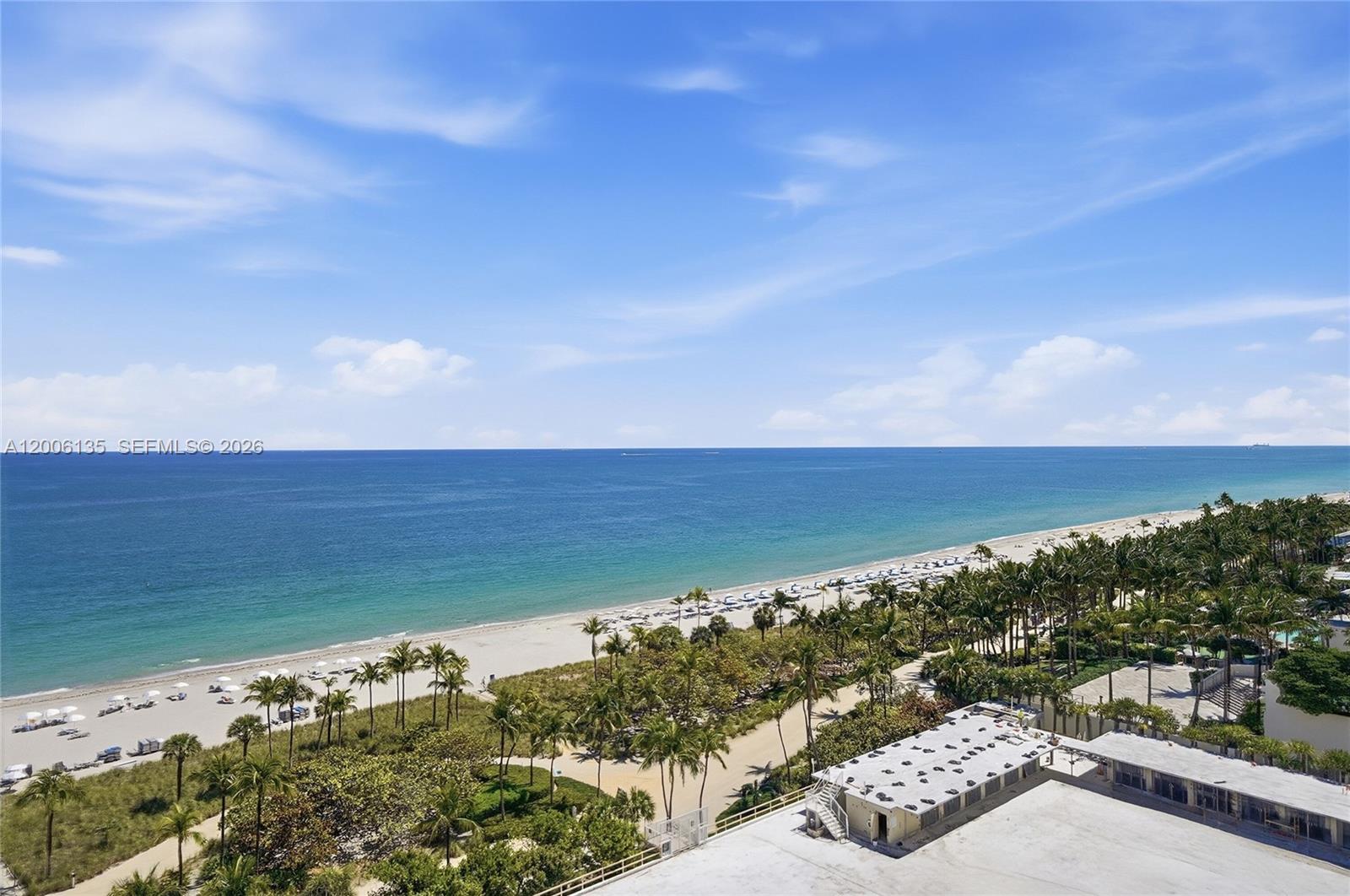 9801 Collins Avenue, Unit 14D Bal Harbour, FL 33154 - Photo 46 of 52 a view of a lake with a yard