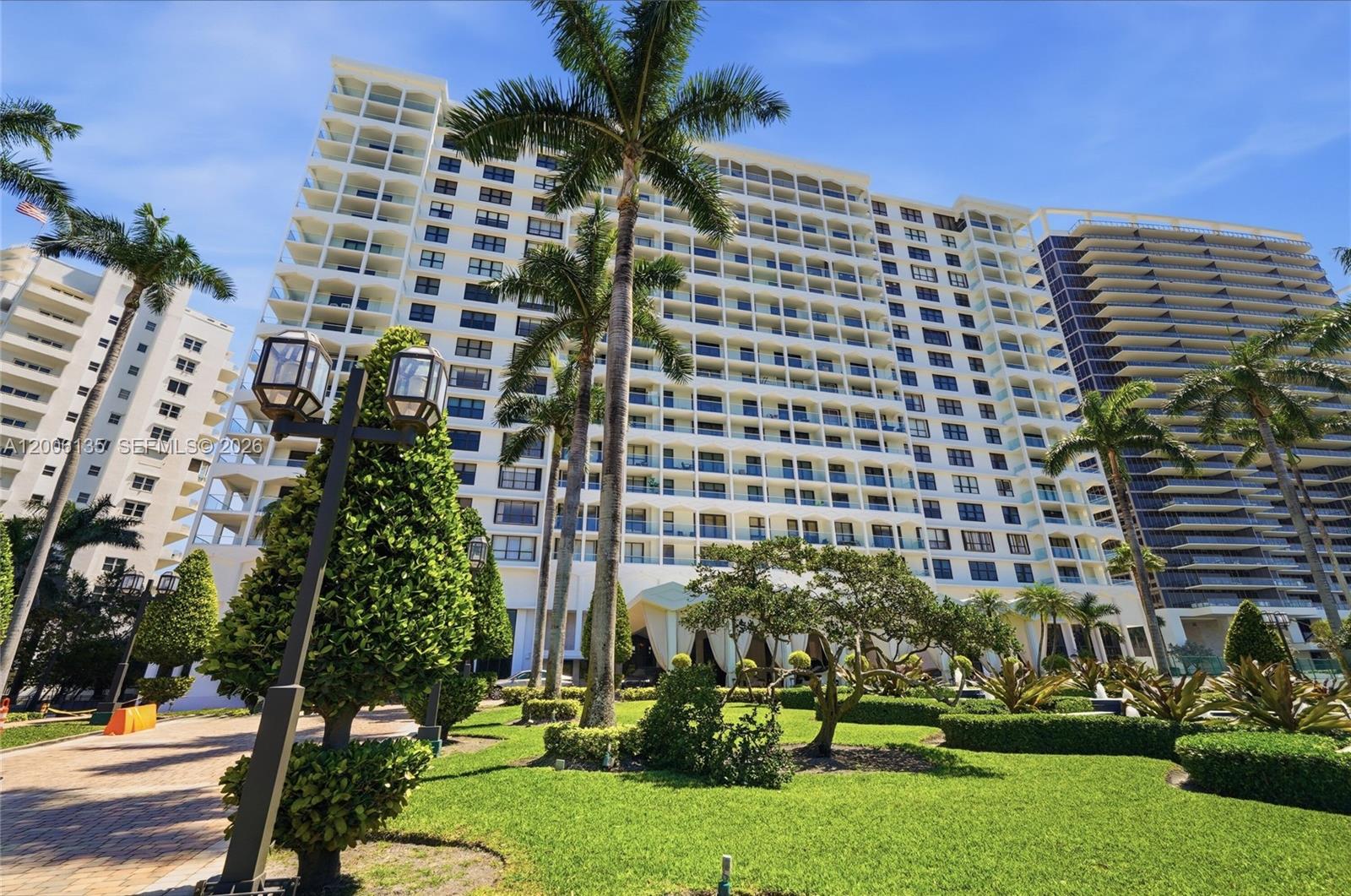 9801 Collins Avenue, Unit 14D Bal Harbour, FL 33154 - Photo 51 of 52 a front view of a building with a garden