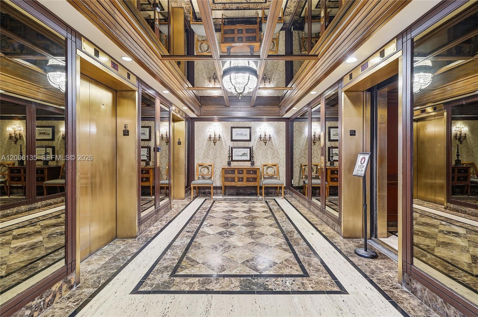 9801 Collins Avenue, Unit 14D Bal Harbour, FL 33154 - Photo 9 of 52 a view of a hallway with wooden floor