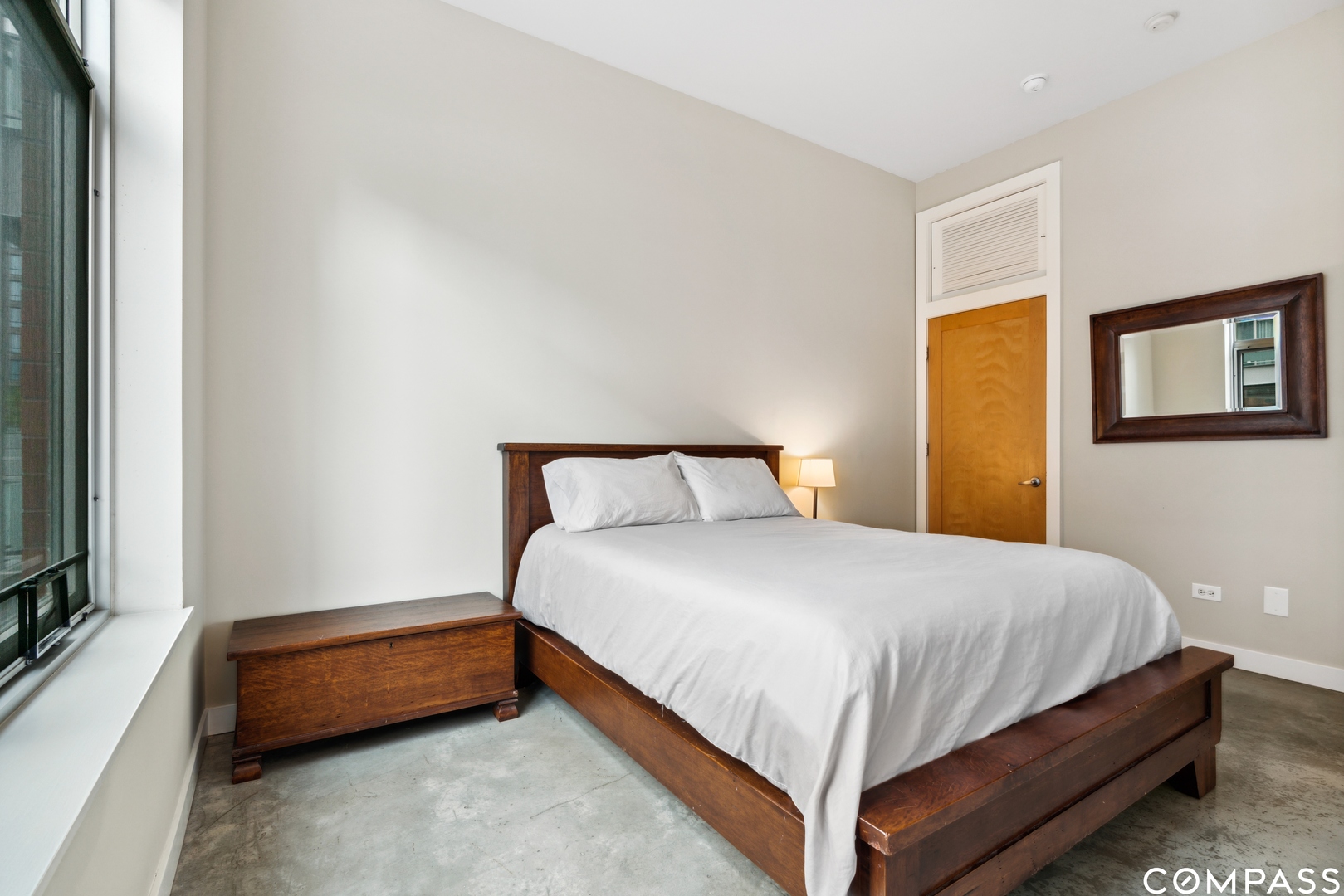 939 West Madison Street, Unit 306 Chicago, IL 60607 - Photo 11 of 15 a bedroom with a bed and a flat tv screen on a dresser