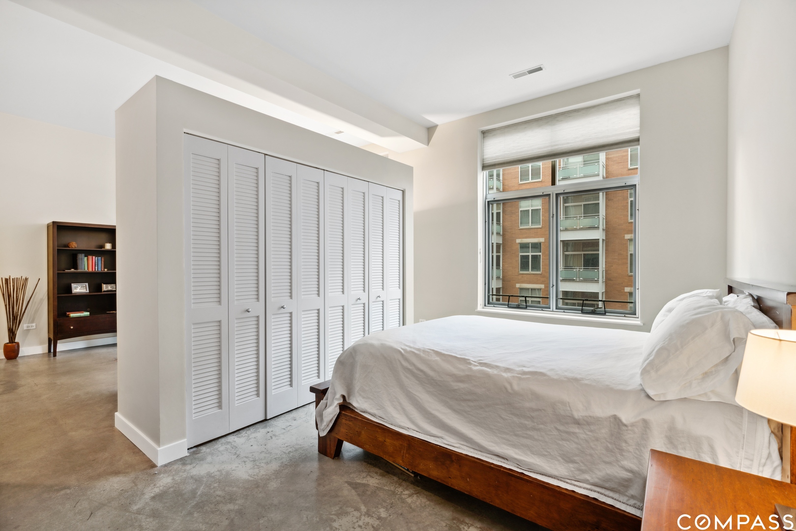 939 West Madison Street, Unit 306 Chicago, IL 60607 - Photo 12 of 15 a bedroom with a bed and a window
