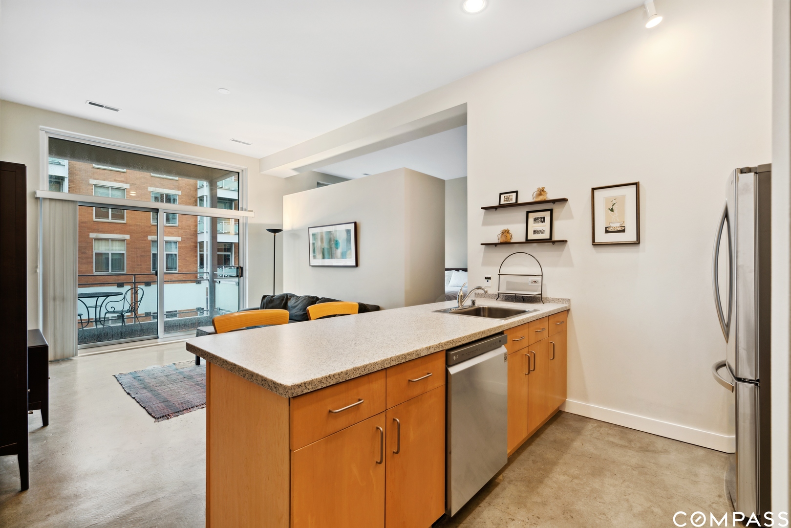 939 West Madison Street, Unit 306 Chicago, IL 60607 - Photo 9 of 15 a kitchen with a sink stove and refrigerator