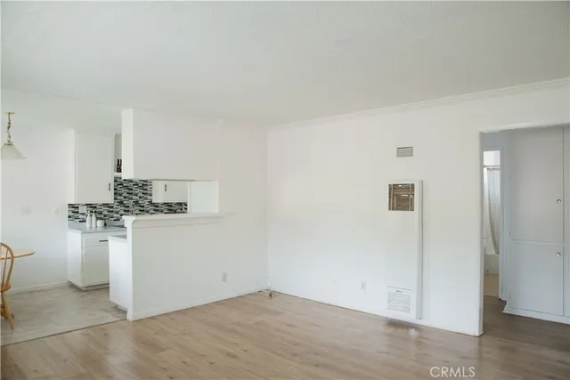 a kitchen with a refrigerator and white stove