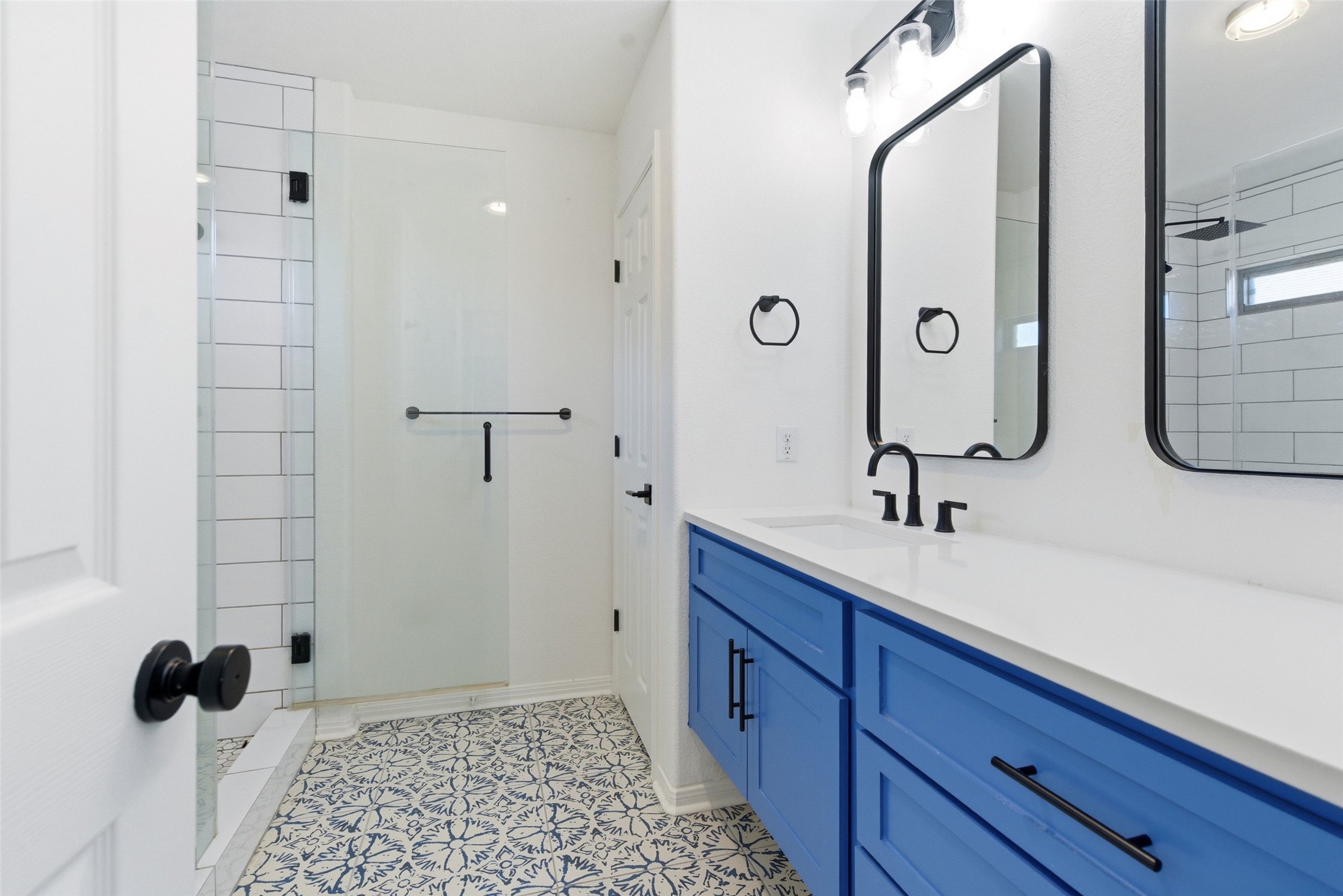 2513 Winchell Lane Austin, TX 78725 - Photo 8 of 23 a bathroom with a double vanity sink and mirror