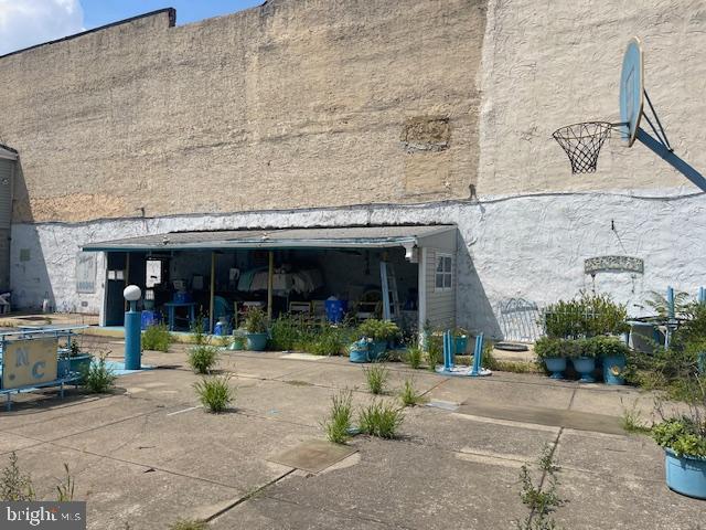 1307 South 6th Street Philadelphia, PA 19147 - Photo 27 of 30 front view of a brick building with potted plants
