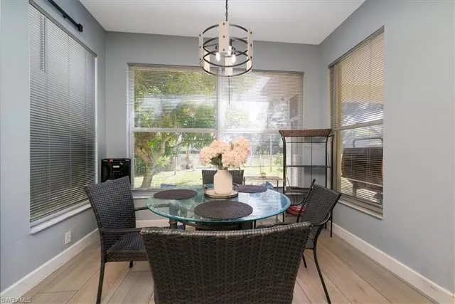 a kitchen with a sink cabinets and wooden floor