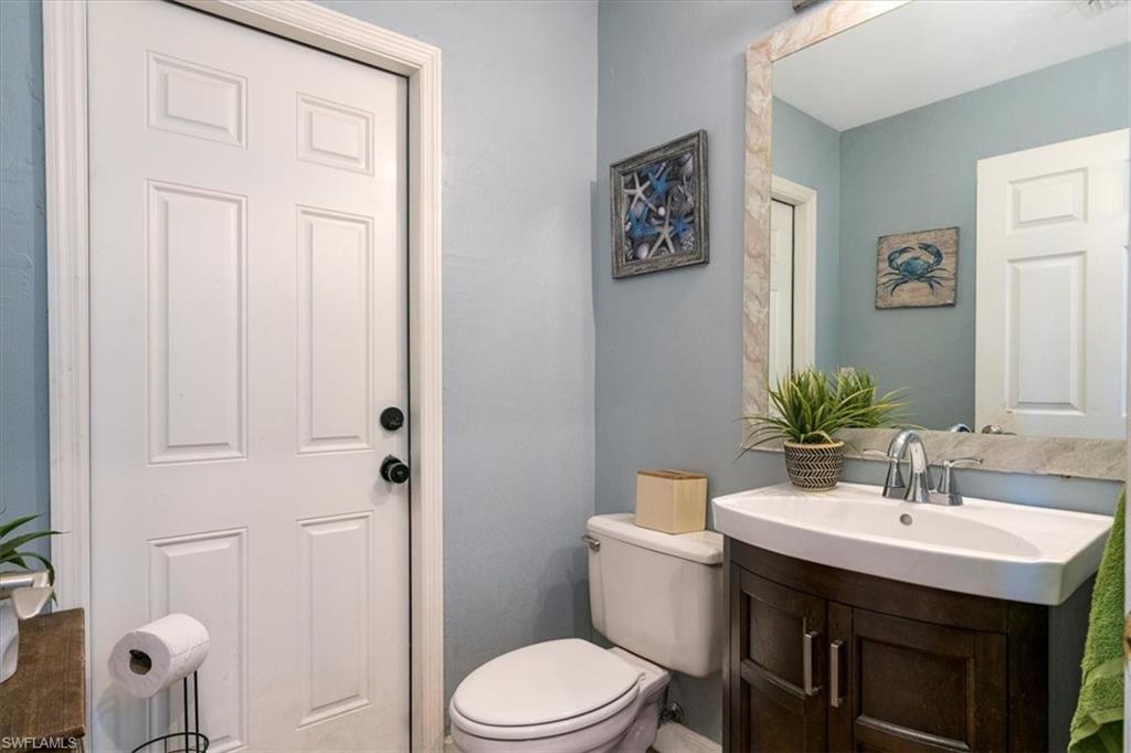 22855 Forest Ridge Drive Estero, FL 33928 - Photo 11 of 49 a bathroom with a sink toilet and shower