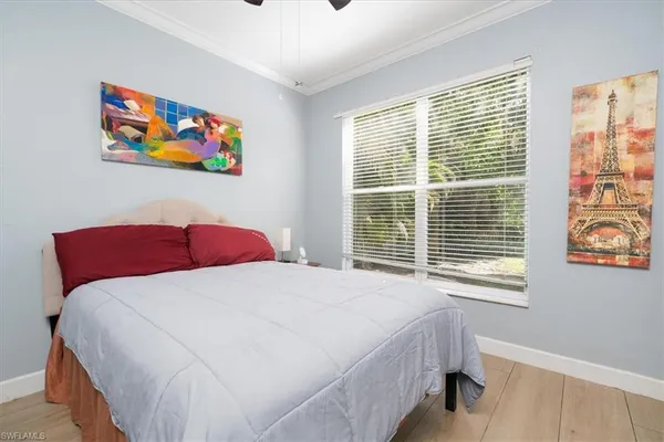a bedroom with a bed and a desk