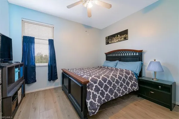 a bedroom with a bed and a cabinets