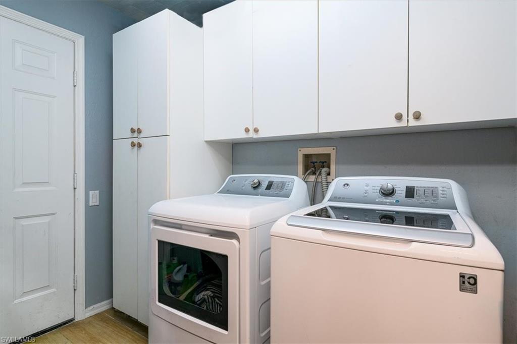22855 Forest Ridge Drive Estero, FL 33928 - Photo 27 of 49 a utility room with dryer and washer