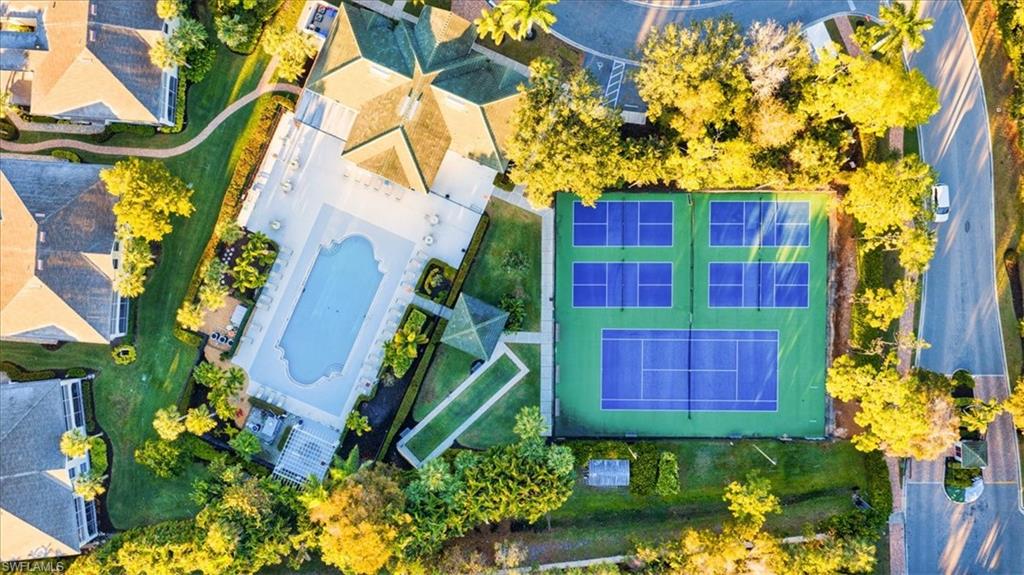 22855 Forest Ridge Drive Estero, FL 33928 - Photo 36 of 49 a building view with swimming pool and outdoor seating