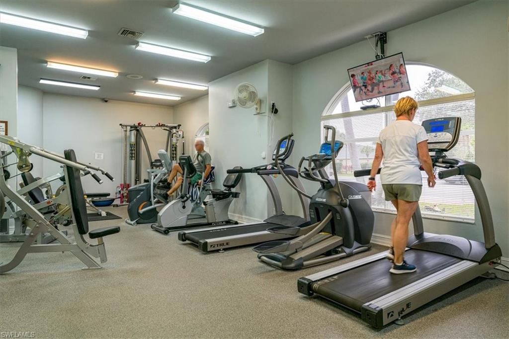 22855 Forest Ridge Drive Estero, FL 33928 - Photo 39 of 49 a room with gym equipment