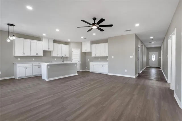 a view of kitchen with wooden floor and window