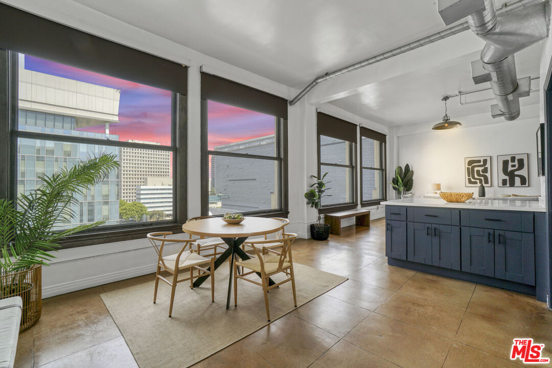 108 West 2nd Street, Unit 915 Los Angeles, CA 90012 - Photo 2 of 27 a living room with furniture and a large window