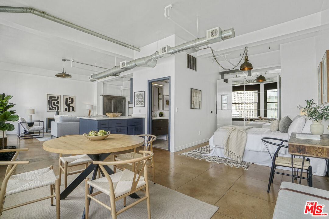 108 West 2nd Street, Unit 915 Los Angeles, CA 90012 - Photo 21 of 27 a view of a livingroom with furniture and window