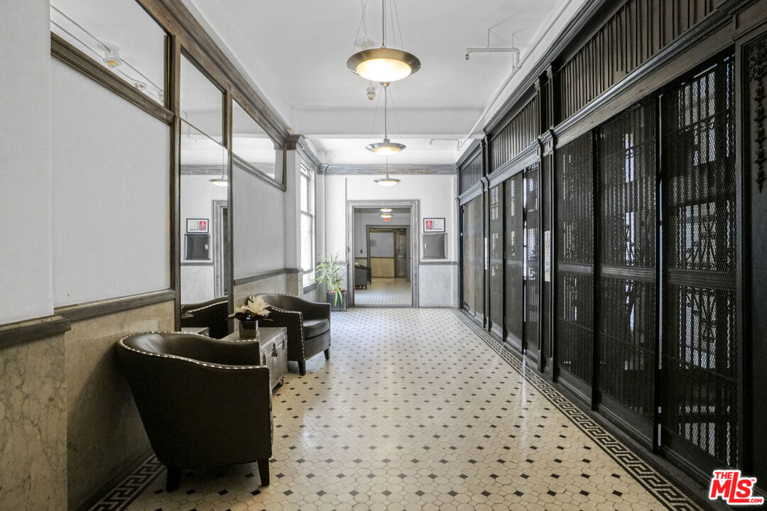 108 West 2nd Street, Unit 915 Los Angeles, CA 90012 - Photo 24 of 27 a living room with furniture