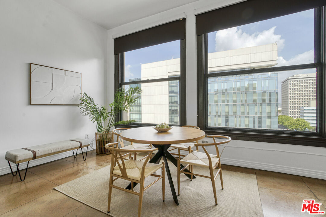 108 West 2nd Street, Unit 915 Los Angeles, CA 90012 - Photo 10 of 27 a dining room with furniture and window