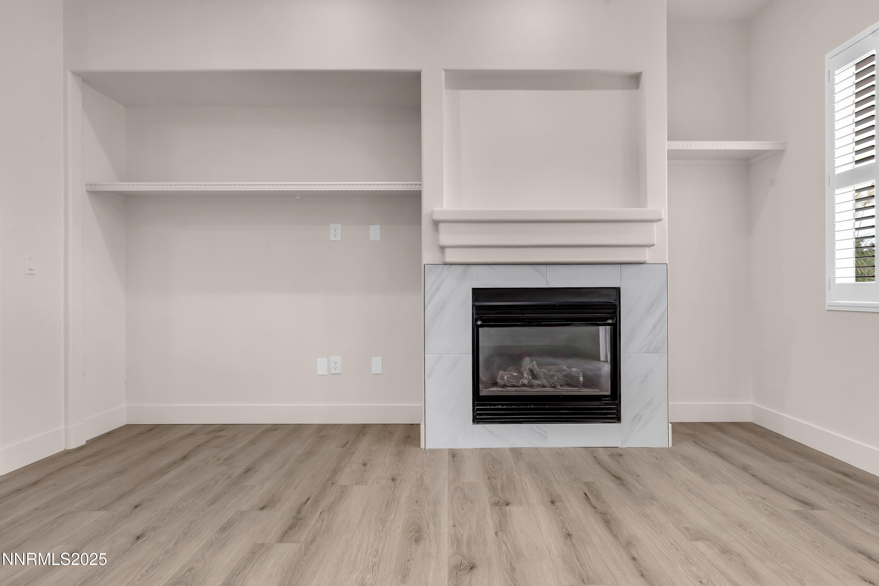 1651 Emerald Bay Drive Reno, NV 89521 - Photo 11 of 50 an empty room with a fireplace