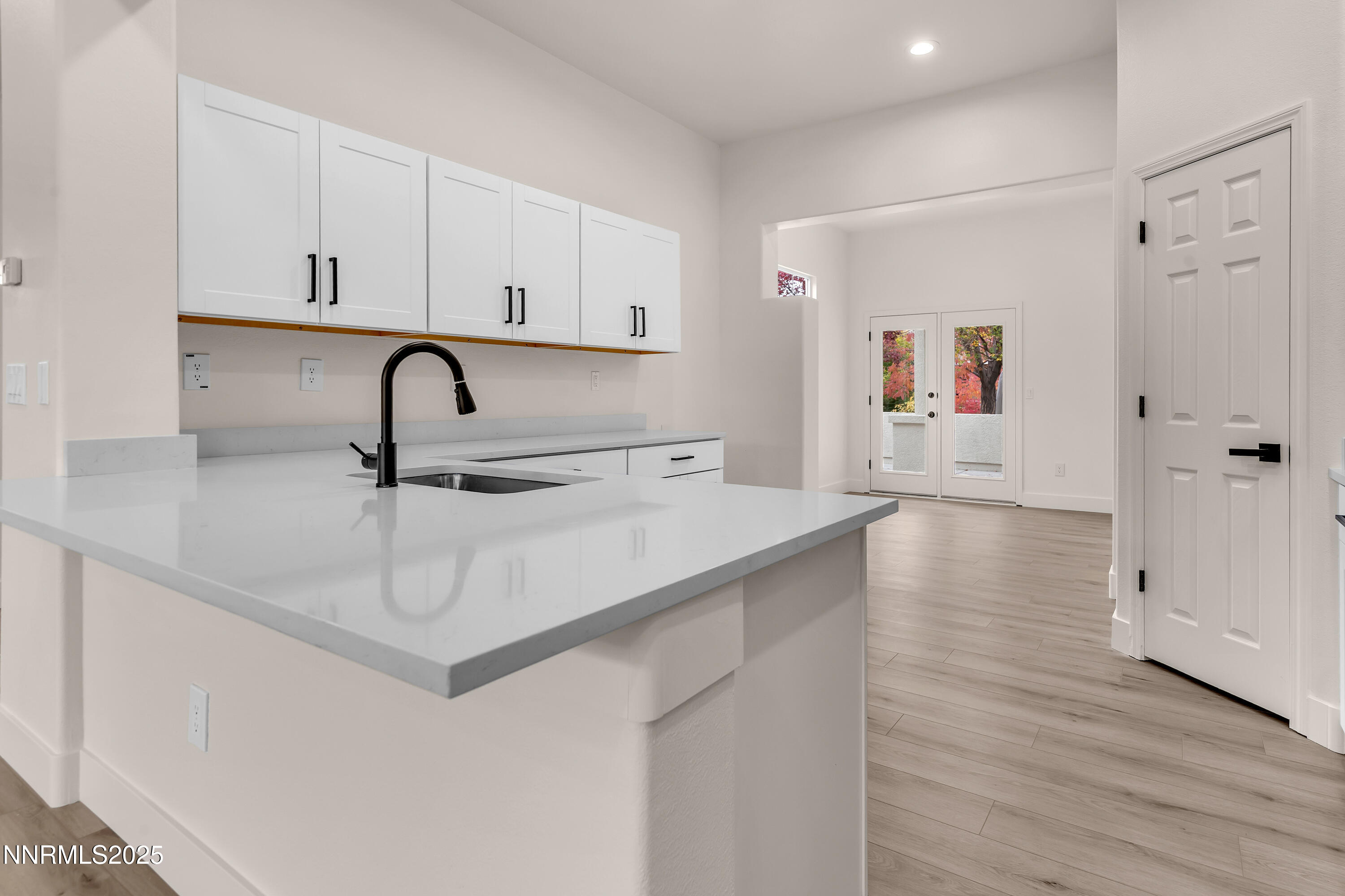 1651 Emerald Bay Drive Reno, NV 89521 - Photo 13 of 50 a kitchen with a sink cabinets and wooden floor