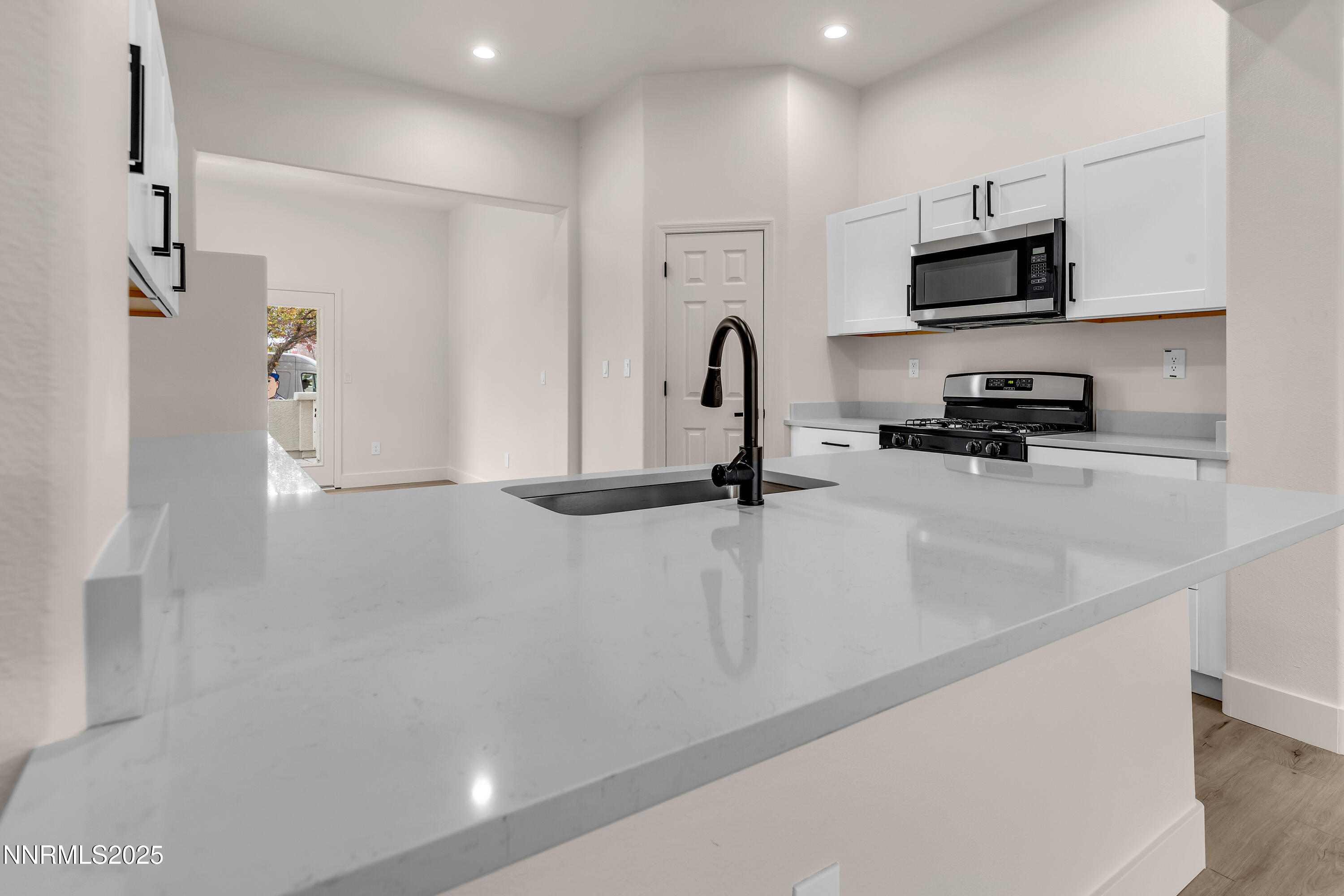 1651 Emerald Bay Drive Reno, NV 89521 - Photo 14 of 50 a view of kitchen with a sink and a refrigerator