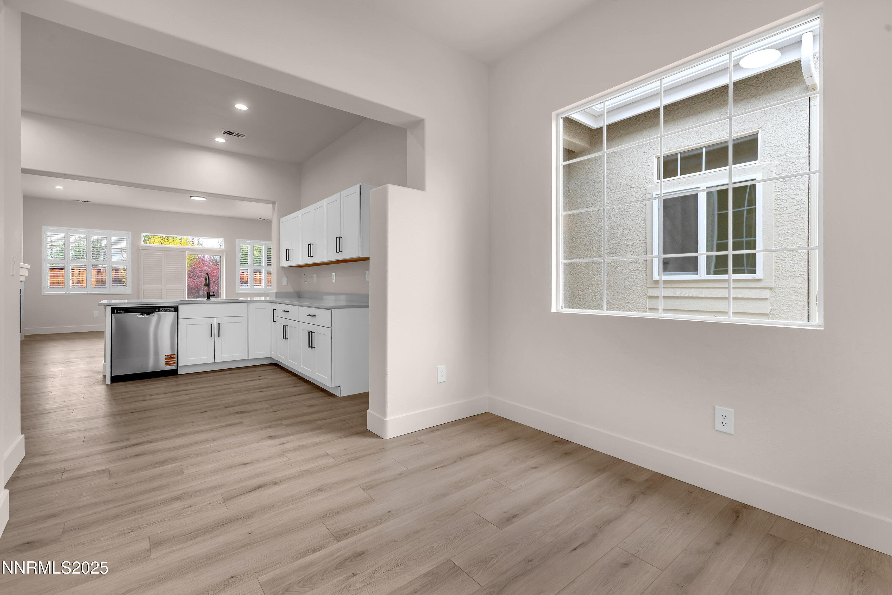 1651 Emerald Bay Drive Reno, NV 89521 - Photo 19 of 50 a view of a kitchen with a refrigerator a stove top oven and a dishwasher