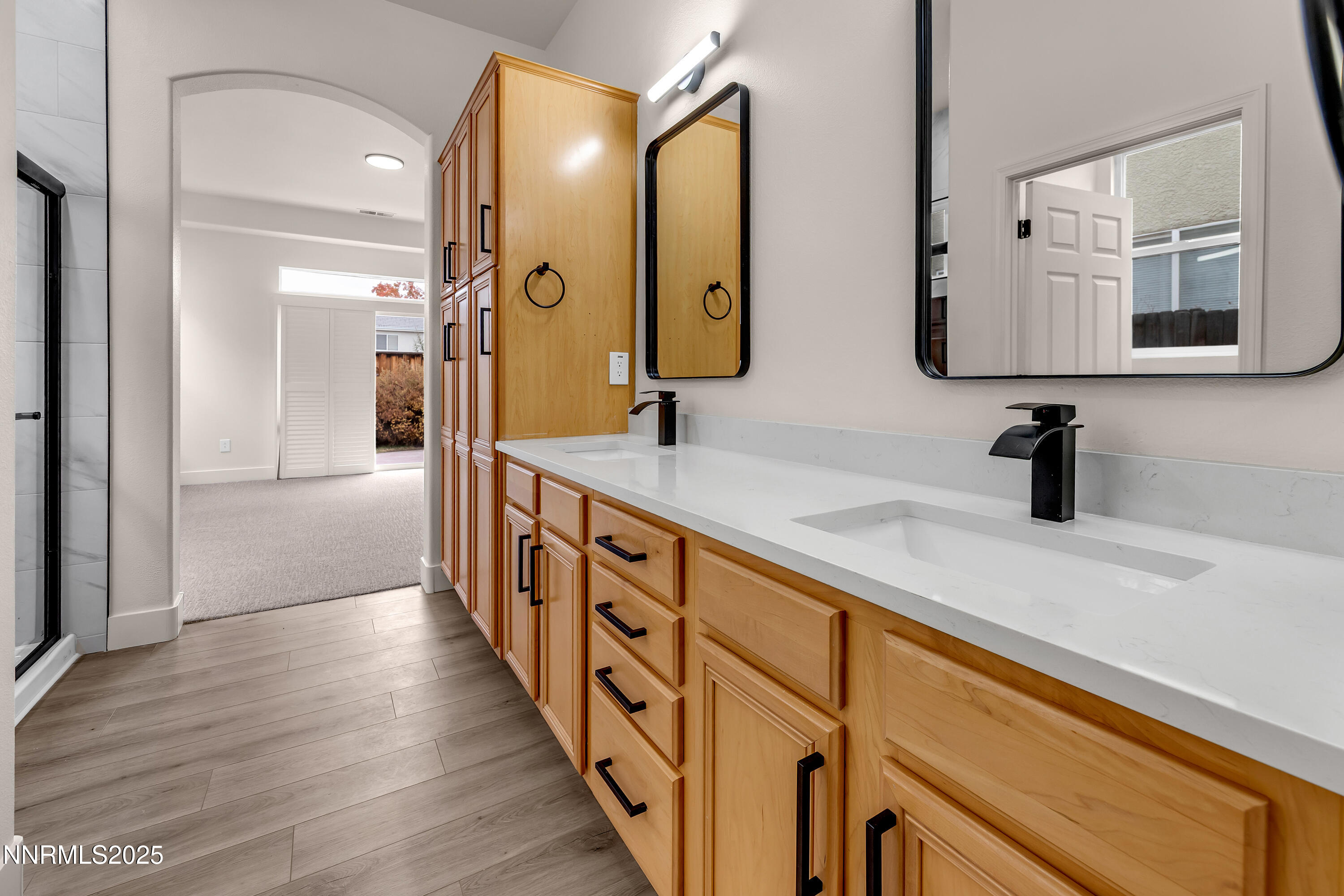 1651 Emerald Bay Drive Reno, NV 89521 - Photo 27 of 50 a bathroom with double vanity and a mirror