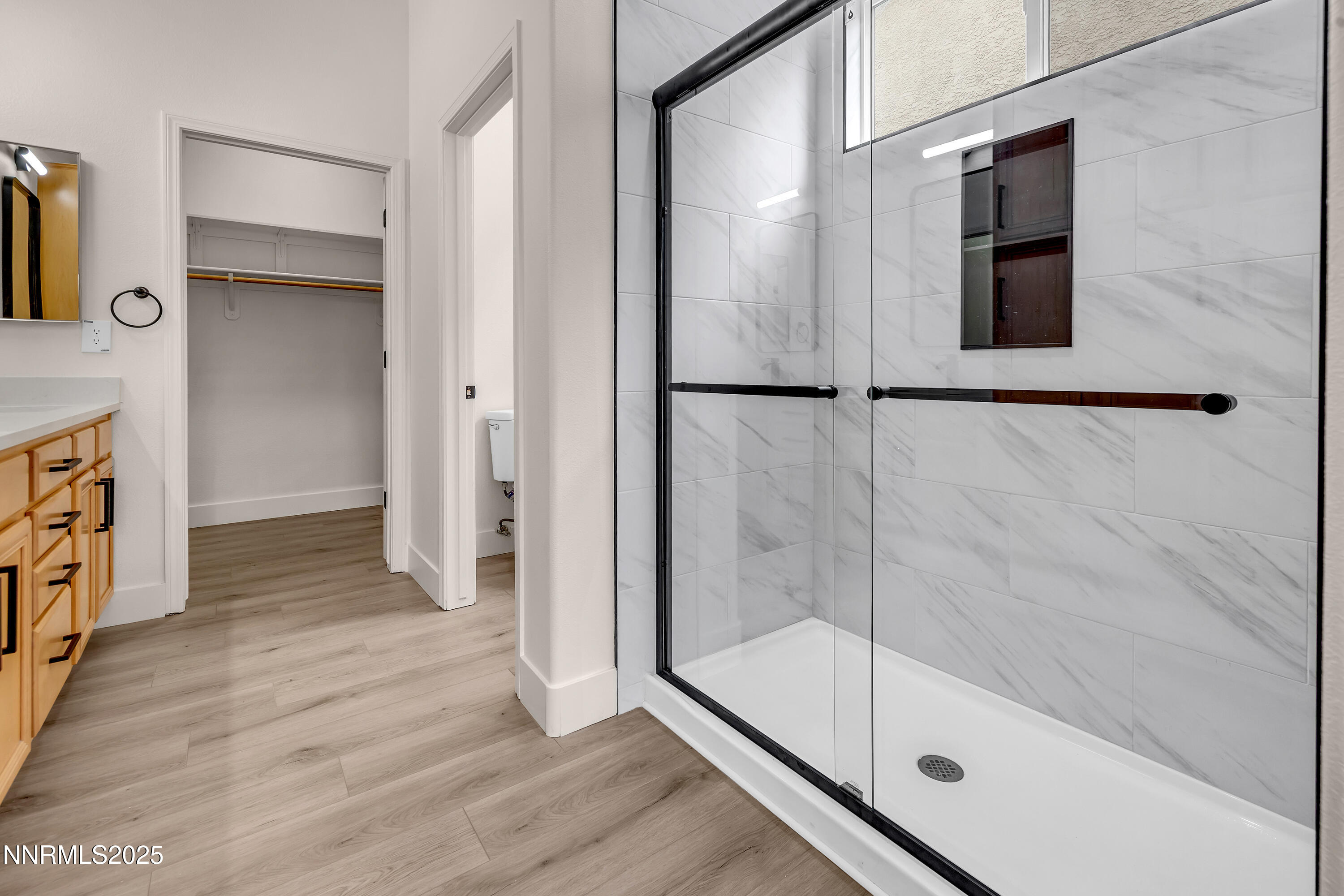 1651 Emerald Bay Drive Reno, NV 89521 - Photo 28 of 50 a bathroom with a glass shower door