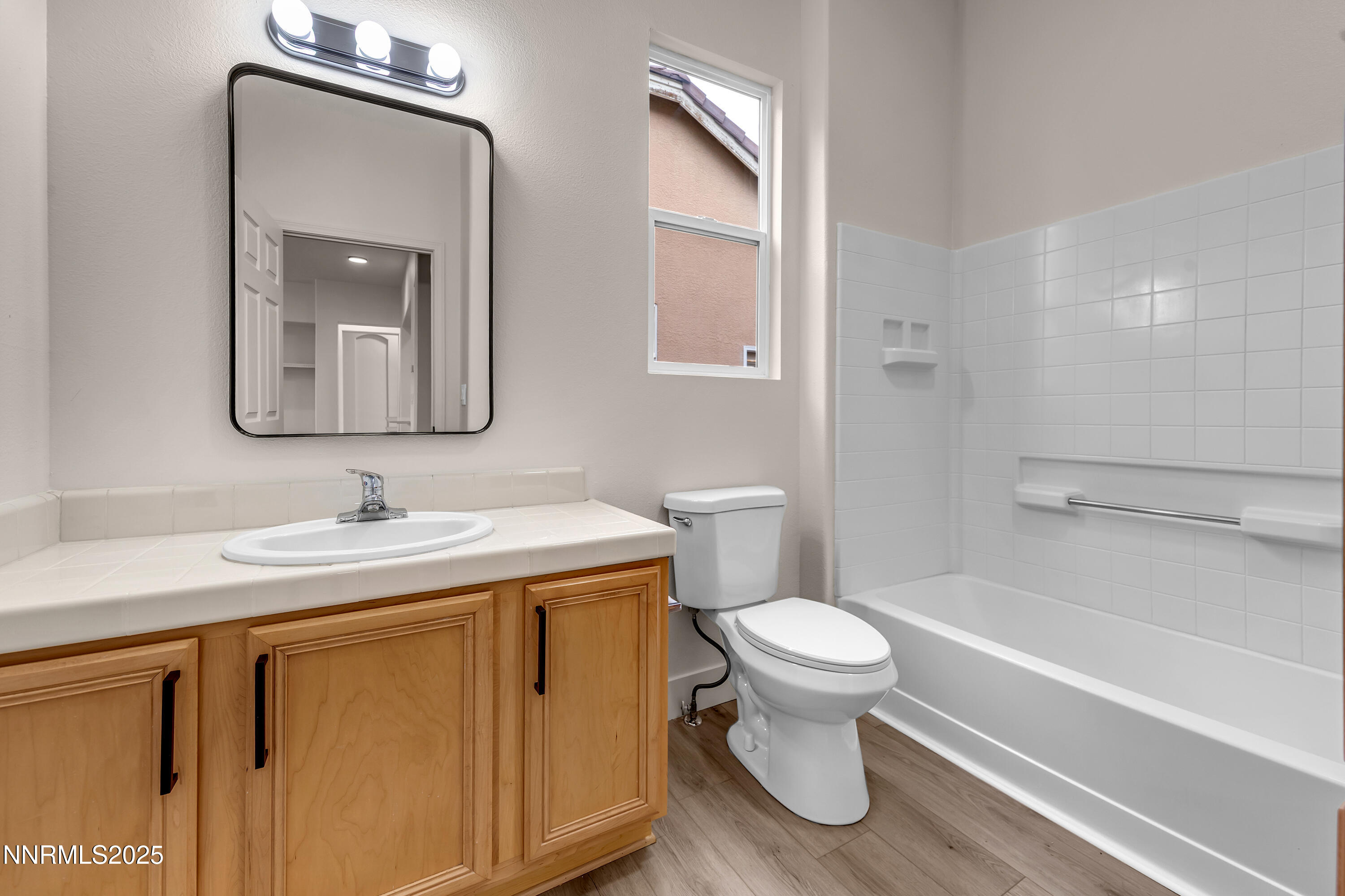 1651 Emerald Bay Drive Reno, NV 89521 - Photo 34 of 50 a bathroom with a toilet sink and mirror