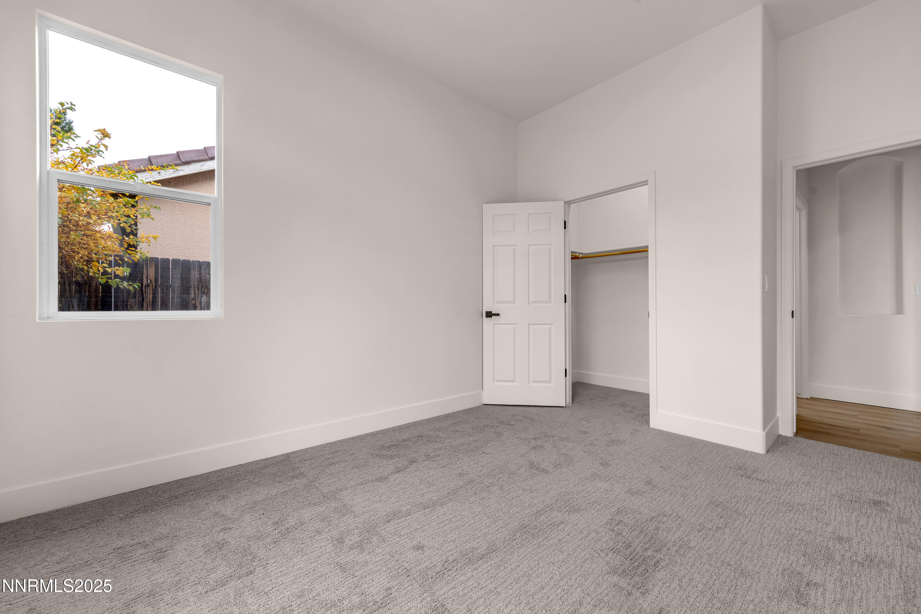 1651 Emerald Bay Drive Reno, NV 89521 - Photo 37 of 50 an empty room with windows and closet